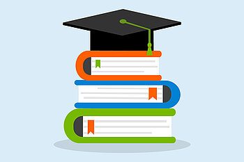 Books and a graduation hat