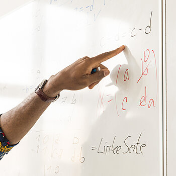 Finger on a whiteboard
